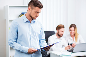 Fototapeta premium Happy smart business man with team mates