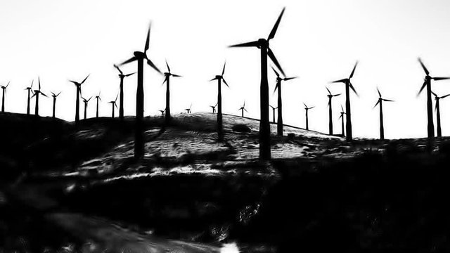 A high contrast black and white field of wind turbines on a hillside.