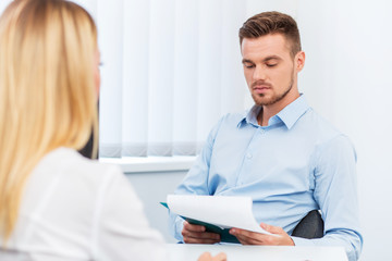 Fototapeta premium man and a woman being interviewed in the office
