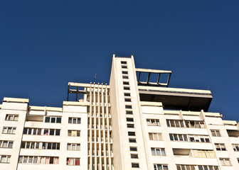 Fototapeta na wymiar Residential building against blue sky.