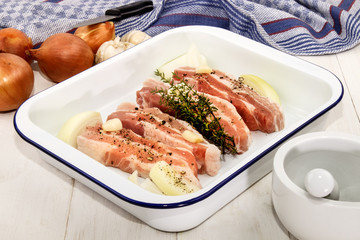 raw pork belly with crushed peppercorn, garlic, onion and fresh