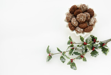 
Homemade authentic German Gingerbread cookies and an artificial  Holly Berry Branch as Christmas...