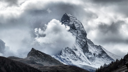 Majestic Matterhorn Mountain in Clouds, the symbol of the Swiss Alps.