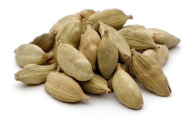 Cardamom seeds on a white background