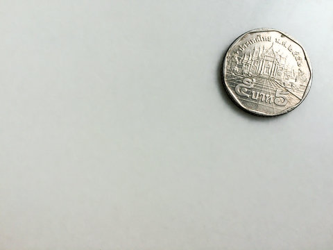 Thai Five baht coin on marble table with copy space