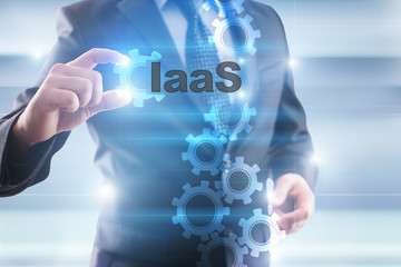 Businessman is selecting "IaaS" on the virtual screen.