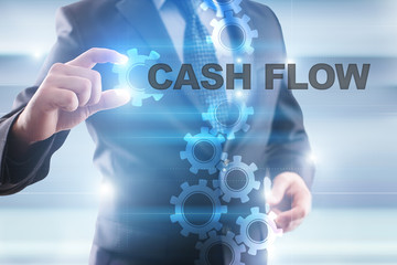 Businessman is selecting "Cash flow" on the virtual screen.