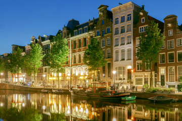 Fototapeta na wymiar Amsterdam. City Canal at dawn.