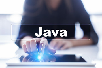 Woman is using tablet pc, pressing on virtual screen and selecting "Java".