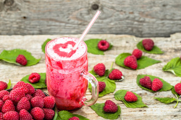 Blended smoothie, raspberry fresh fruits milkshake in a glass jar