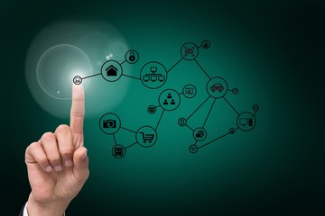 hand pointing to graphic with technology background