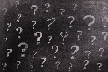 Question-marks on chalkboard