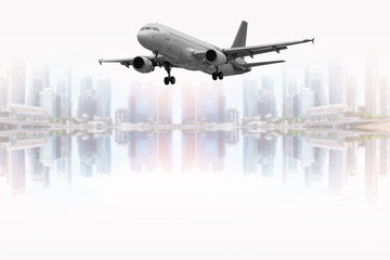 Civil aircraft with beautiful blurred skyscrapers background.