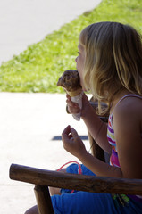 girl eating chocolate ice cream cone