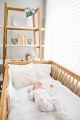 Obraz na płótnie Canvas Baby boy relaxing on a cradle