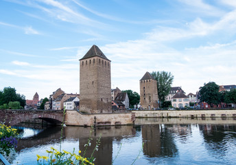Obraz premium Les ponts couverts de Strasbourg, two out of three towers. View from Barrage Vauban in Alsace, France at evening day of clear blue sky.
