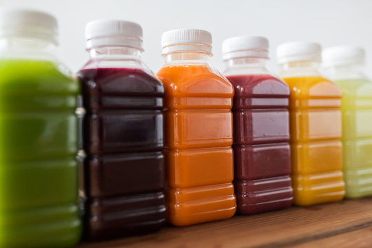 bottles with different fruit or vegetable juices