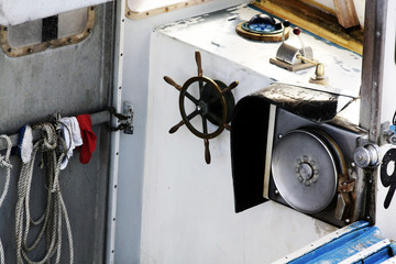 A Boats Work Space. This captain's control room " The Ships Bridge" on this working commercial fishing boat isolated to show that not everyone's work-space is a desk or a computer. © dansanders