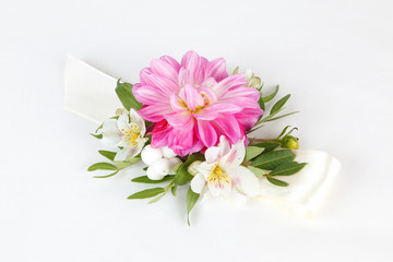 Pink wrist corsage isolated on white background 