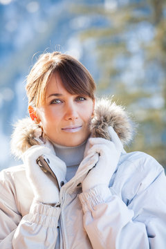 portrait of a beautiful woman in winter with protective lip cream
