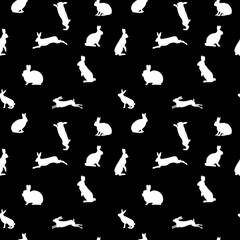 Rabbit silhouettes on a black background