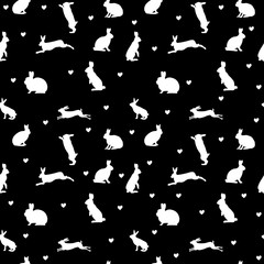 Rabbit silhouettes and hearts on a black background