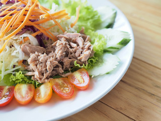 Tasty salad , tuna and vegetables on the plate