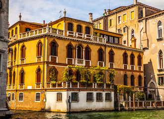 VENICE, ITALY - AUGUST 19, 2016: Famous architectural monuments and colorful facades of old...