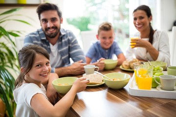 Portrait of family having breakfast