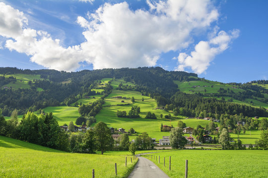 Country road in Brixental Valley in Tirolean Alps, Austria, popular summer and winter location for tourism .