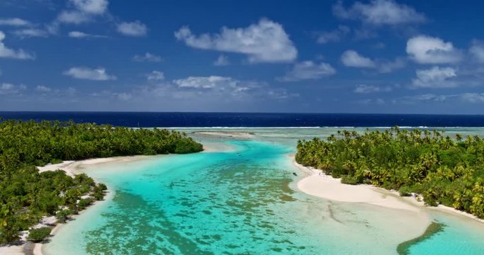 Aerial view of beautiful tropical island lagoon and white sand beach in the South Pacific