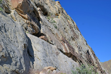 Large Stone Face against blue sky