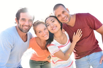 Group of friends having fun in summer