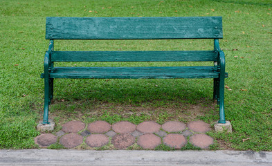 wooden park bench at a park