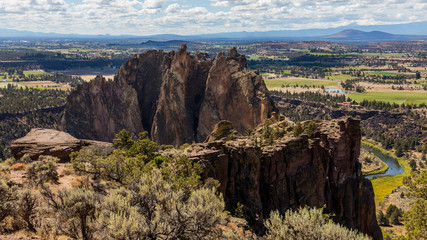 Colorful valley between the mountains. High mountains on the horizon. Smith Rock state park, Oregon