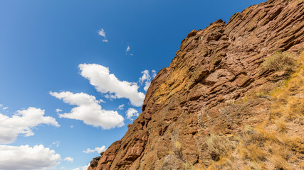 Unusual shaped rocks on the background of blue sky. Beautiful landscape of yellow sharp cliffs. Smith Rock state park, Oregon