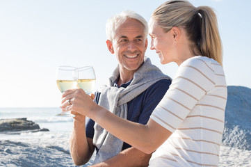 Mature couple raising toast