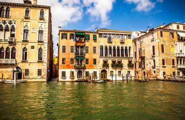 VENICE, ITALY - AUGUST 19, 2016: Famous architectural monuments and colorful facades of old...