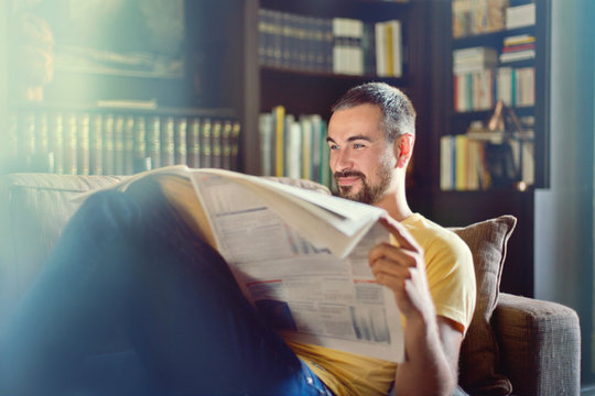 Man Reading The Newspaper