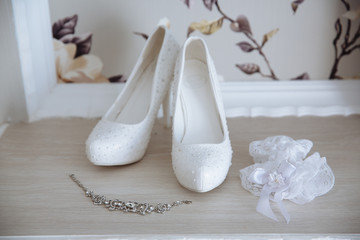 Wedding jewelry. Accessories of the bride. Shoes, bracelet