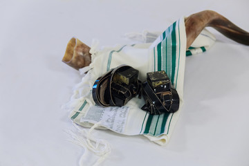 shofar horn on white prayer talit. rosh hashanah
