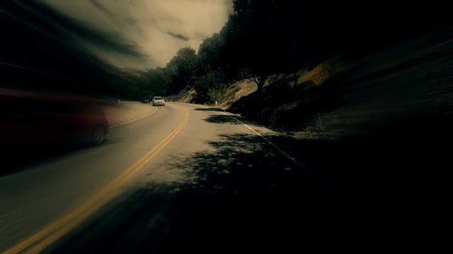 A stylized time lapse of driving POV with distortion and motion blur.