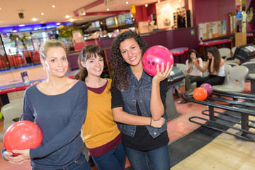 Portrait of three women in bowling alley