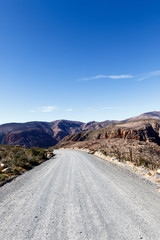 Gravel road leading to the mountains