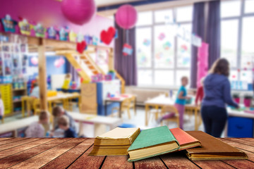 tree aged book and grunge paper on wooden platform in classroom ,back to school concept.
