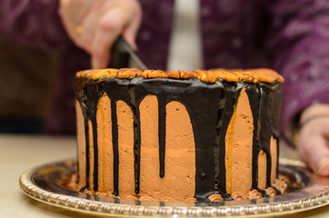 Cutting Chocolate Birthday Cake with a Knife