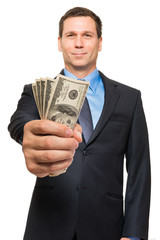 Businessman with fistful of money on white