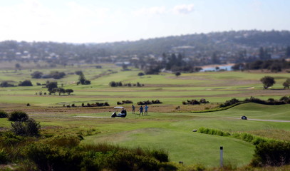 Fototapeta na wymiar Sydney, Australia - Jan 7, 2013. Men playing golf on Long Reef Golf Course.