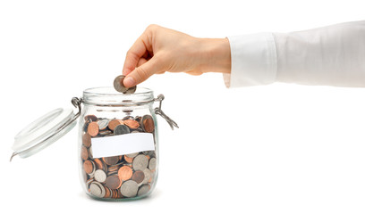 Woman Dropping Coins into Glass Jar