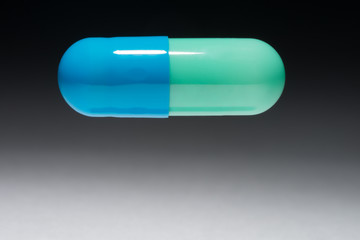 Blue Green Prescription Medicine Capsule